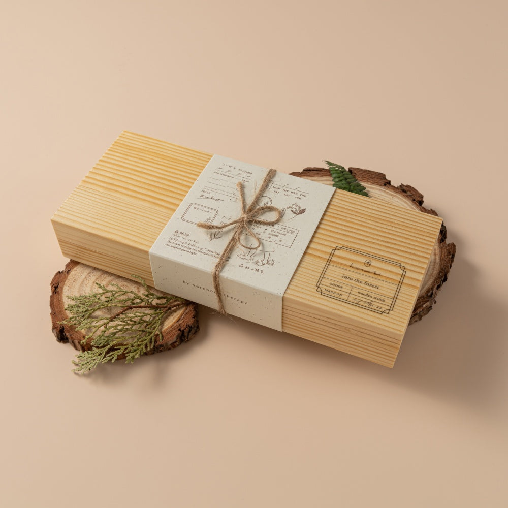 Wooden box of Hinoki Into the Forest stamps with twine wrapped around it