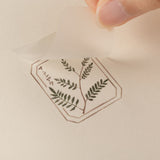 Close up of transfer sticker with leaf design