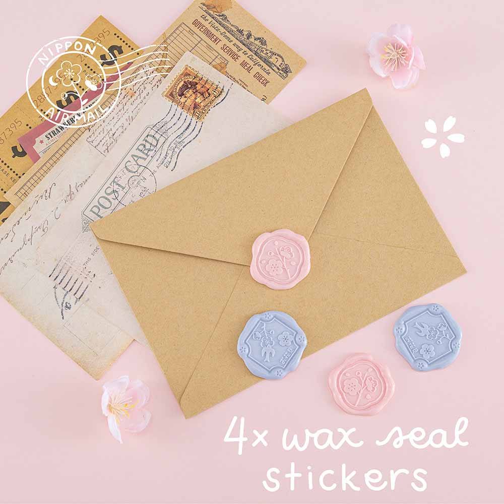 Tsuki ‘Sakura Journey’ Scrapbooking Set with four wax seal stickers on envelope on pink background