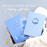 Tsuki Four Seasons Winter Collector’s Edition Bullet Journal with free stickers sheet and luxury eco-friendly gift box with linen cloth in wicker basket with stars on light blue background