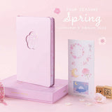 Tsuki Four Seasons: Spring Collector’s Edition 2022 Bullet Journal with Tsuki ‘Sakura Journey’ Bullet Journal Stamps with sakura blooms in light pink background
