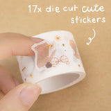  Tsuki Light Academia sticker tape roll close up on brown background with text ‘17x die cut cute stickers’ in white