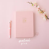 Tsuki 'Sakura' Limited Edition Bullet Journal in petal pink with bookmark gift and pink pen and flower branch on light pink background