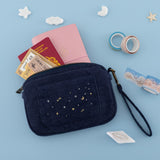 Cloud Dreamland travel pouch with Sakura Journey travel notebook, passport and tickets inside