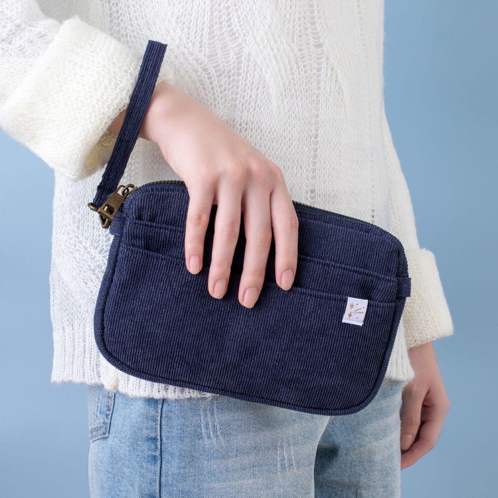 Tsuki ‘Cloud Dreamland’ Travel Pouch being held by model
