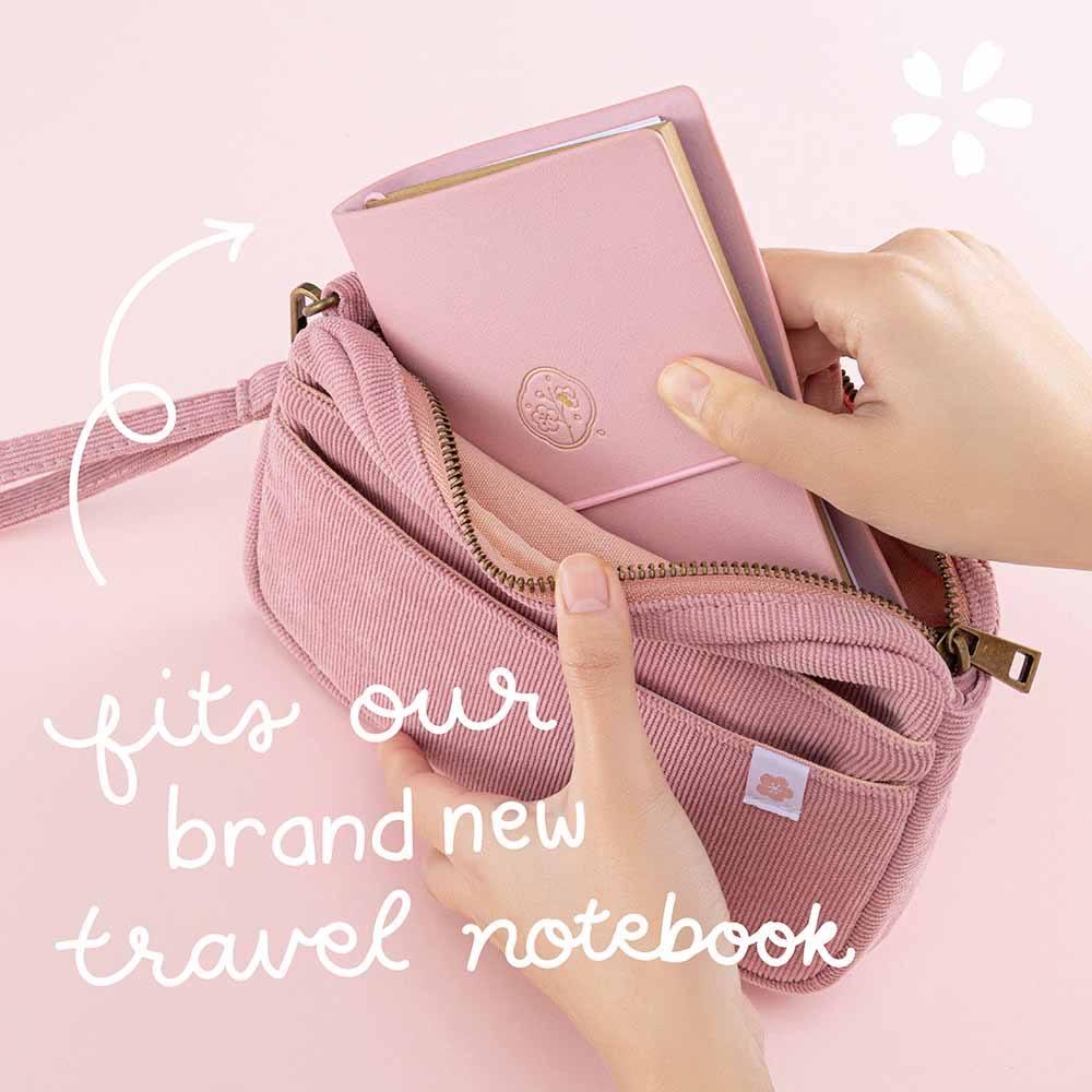 Tsuki ‘Sakura Journey’ Travel Pouch which fits brand new Tsuki ‘Sakura Journey’ Limited Edition Travel Notebook inside held in hands on pink background