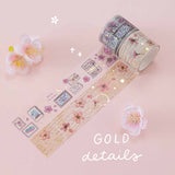 Close up of Tsuki ‘Sakura Journey’ Vintage Journal Washi Tapes with gold details with cherry blossoms on pink background