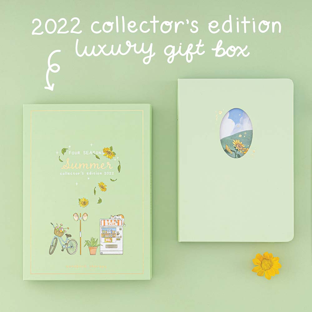 Flatlay photo of Tsuki Four Seasons Summer Collectors Edition 2022 sage bullet journal notebook showing the luxury gift box and the notebook on sage green background