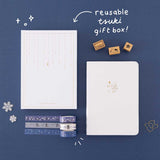 Tsuki ‘Suzume’ Winter Limited Edition Bullet Journal with reusable Tsuki gift box and free paperclip gift with Tsuki ‘Dreams of Snow’ Holographic Washi Tapes and Tsuki ‘Dreams of Snow’ Bullet Journal Stamps on navy background