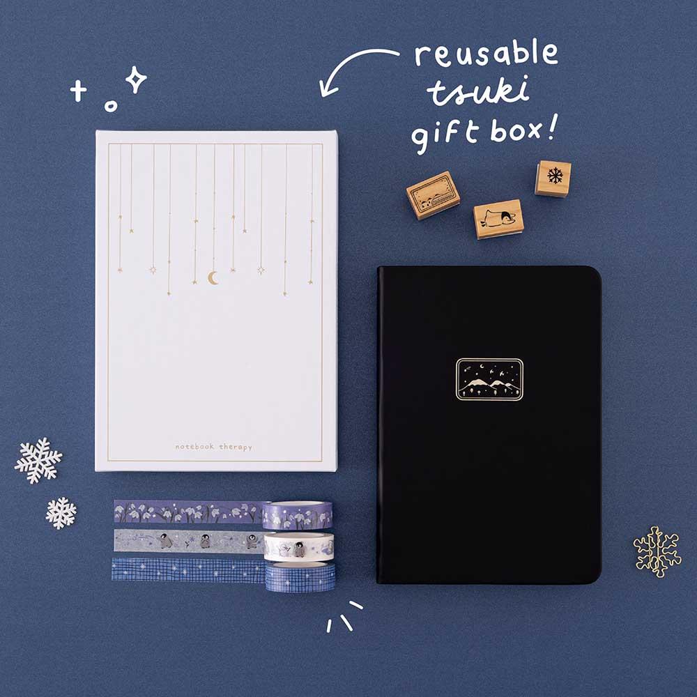 Tsuki ‘Winter Journey’ Limited Edition Bullet Journal with reusable Tsuki gift box and free paperclip gift with Tsuki ‘Dreams of Snow’ Holographic Washi Tapes and Tsuki ‘Dreams of Snow’ Bullet Journal Stamps on navy background