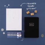 Tsuki ‘Winter Journey’ Limited Edition Bullet Journal with reusable Tsuki gift box and free paperclip gift with Tsuki ‘Dreams of Snow’ Holographic Washi Tapes and Tsuki ‘Dreams of Snow’ Bullet Journal Stamps on navy background