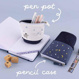 Tsuki ‘Dreams of Snow’ Pop-Up Pencil Cases in Starry Night and Playful Penguin which double as a pen pot on open bullet journal spread with Tsuki ‘Dreams of Snow’ Bullet Journal Stamps and Tsuki ‘Dreams of Snow’ Holographic Washi Tapes on light blue background